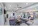 Stylish living room featuring modern furniture, ceiling fans, recessed lights, and an open layout at 114 E Garfield St, Tempe, AZ 85288