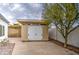 Backyard view of a neutral-colored storage shed with double doors and easy access to extra storage space at 114 E Garfield St, Tempe, AZ 85288