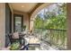 Outdoor living with seating and views of surrounding lush greenery, found on the home's private balcony at 11640 N Tatum Blvd # 2063, Phoenix, AZ 85028