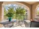 Serene balcony showcasing outdoor seating and lush greenery, with views of surrounding trees at 11640 N Tatum Blvd # 2063, Phoenix, AZ 85028