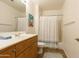 Clean, well-lit bathroom with a single sink, vanity, and a shower-tub combo at 11640 N Tatum Blvd # 2063, Phoenix, AZ 85028