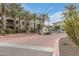 Apartment complex entry with palm trees and a gated entry at 11640 N Tatum Blvd # 2063, Phoenix, AZ 85028