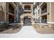 Apartment exterior with a gated entrance, and lush landscaping at 11640 N Tatum Blvd # 2063, Phoenix, AZ 85028