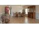 Formal dining room area with hardwood floors, classic furniture, and plenty of natural light at 11868 W Kinderman Dr, Avondale, AZ 85323