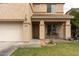 Charming two-story home with a front porch and well-maintained landscaping at 11868 W Kinderman Dr, Avondale, AZ 85323