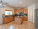 Bright kitchen with stainless appliances, granite countertops, and a kitchen island at 11868 W Kinderman Dr, Avondale, AZ 85323