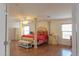 Bright bedroom boasts wood floors and en-suite bath at 11868 W Kinderman Dr, Avondale, AZ 85323