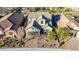 Stunning aerial view of a two-story home with an attached garage and a well-manicured front yard with brick pavers at 12918 W Caraveo Pl, Peoria, AZ 85383