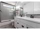 Modern bathroom featuring double vanity, glass enclosed shower with subway tile at 12918 W Caraveo Pl, Peoria, AZ 85383