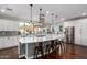 Modern kitchen featuring an oversized island, stainless steel appliances, and natural light at 12918 W Caraveo Pl, Peoria, AZ 85383