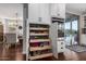 Well-organized kitchen cabinet with pull-out shelves for easy access and modern appliances at 12918 W Caraveo Pl, Peoria, AZ 85383