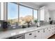 Kitchen with window view, stainless steel appliances and ample counter space at 12918 W Caraveo Pl, Peoria, AZ 85383