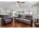 Open-concept living room featuring hardwood floors and seamless transition into the spacious kitchen at 12918 W Caraveo Pl, Peoria, AZ 85383