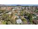 Aerial view of a neighborhood with swimming pools, tree-lined streets, and well-maintained landscaping at 1414 E Vermont Ave, Phoenix, AZ 85014