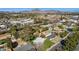 Picturesque aerial view of a residential area surrounded by mountains and featuring lush greenery and mature trees at 1414 E Vermont Ave, Phoenix, AZ 85014