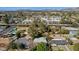 Expansive aerial shot of a neighborhood with single-Gathering homes, mature trees, and mountain views at 1414 E Vermont Ave, Phoenix, AZ 85014