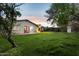 Picturesque backyard with mature trees and lush lawn, creating a serene and inviting outdoor space at 1414 E Vermont Ave, Phoenix, AZ 85014