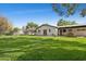 Expansive backyard showcasing a lush lawn, providing ample space for outdoor activities and entertainment at 1414 E Vermont Ave, Phoenix, AZ 85014