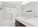 Bright bathroom with subway tile, dark wood vanity and shower tub combo at 1414 E Vermont Ave, Phoenix, AZ 85014