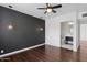 Bedroom with dark accent wall and a view into the bright ensuite bathroom at 1414 E Vermont Ave, Phoenix, AZ 85014