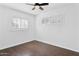 Bright bedroom featuring light hardwood floors, white plantation shutters, and neutral paint at 1414 E Vermont Ave, Phoenix, AZ 85014