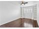 Bright bedroom with hardwood floors, shuttered window, built-in shelving and large closet at 1414 E Vermont Ave, Phoenix, AZ 85014