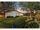 Charming exterior view of home featuring manicured lawn and covered patio at 1414 E Vermont Ave, Phoenix, AZ 85014