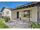 Inviting front porch with brick accents, potted plants, and bench seating at 1414 E Vermont Ave, Phoenix, AZ 85014