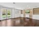 Cozy living room with built-in shelves, French doors, and hardwood floors at 1414 E Vermont Ave, Phoenix, AZ 85014