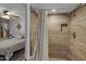 Stylish bathroom with a tiled shower and a glimpse into the adjacent bedroom at 145 N 74Th St # 121, Mesa, AZ 85207