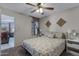 Comfortable bedroom features a ceiling fan, decor, neutral walls, and plush carpet at 145 N 74Th St # 121, Mesa, AZ 85207