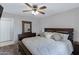 Spacious main bedroom featuring a comfortable bed and view of an adjacent bathroom at 145 N 74Th St # 121, Mesa, AZ 85207