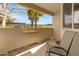 The patio features a small wall-mounted table, two chairs, and outdoor view at 145 N 74Th St # 121, Mesa, AZ 85207