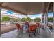 Covered patio with comfortable seating, perfect for outdoor relaxation and entertainment at 15116 W Carbine Way, Sun City West, AZ 85375