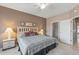 Main bedroom showcasing neutral walls and a view into the walk-in closet at 15116 W Carbine Way, Sun City West, AZ 85375