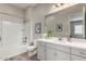 Bathroom featuring gray vanity, tub shower, and modern fixtures at 1557 E Flower St, Gilbert, AZ 85298