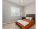 This comfy bedroom features carpet, a window with shutters, and a rustic wood bed frame at 1557 E Flower St, Gilbert, AZ 85298