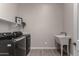 Laundry room featuring shelving, and modern washer and dryer at 1557 E Flower St, Gilbert, AZ 85298