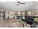 Spacious living room with modern decor that opens up to a stunning kitchen and beautiful flooring at 1557 E Flower St, Gilbert, AZ 85298