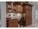 Stylish bar area with wine rack, cabinetry, and desk space for a home office at 15646 E Sunflower Dr, Fountain Hills, AZ 85268