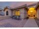 Charming patio area with seating, a walkway to the front door, and desert landscaping at 15646 E Sunflower Dr, Fountain Hills, AZ 85268