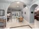 Spacious foyer featuring archways, neutral tile flooring, and views into adjacent living spaces at 15646 E Sunflower Dr, Fountain Hills, AZ 85268