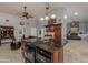 Open-concept kitchen with granite counters, wood cabinets, and seamless flow to the living space at 15646 E Sunflower Dr, Fountain Hills, AZ 85268