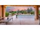 Covered patio overlooking a pool area with desert landscaping for an ideal outdoor living experience at 15646 E Sunflower Dr, Fountain Hills, AZ 85268