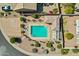 An aerial view shows the community pool with shaded lounging and neighborhood landscaping at 16102 E Glenview Dr, Fountain Hills, AZ 85268