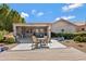 Enjoy outdoor living on this back patio with a dining area and a lush, landscaped backyard at 16102 E Glenview Dr, Fountain Hills, AZ 85268