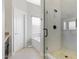 Bright bathroom featuring a glass shower, a soaking tub, and neutral tiling throughout at 16102 E Glenview Dr, Fountain Hills, AZ 85268