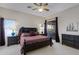 Spacious bedroom with ceiling fan, slider to patio, neutral walls, and well-appointed furniture at 16102 E Glenview Dr, Fountain Hills, AZ 85268