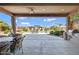 Expansive covered patio with ample seating, an outdoor kitchen, and a well-maintained backyard at 16102 E Glenview Dr, Fountain Hills, AZ 85268