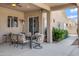 Spacious covered patio with comfortable seating, ceiling fan, and a view of the landscaped backyard at 16102 E Glenview Dr, Fountain Hills, AZ 85268